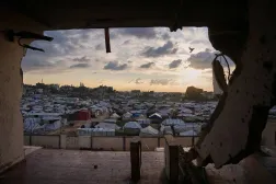 Seen from a building heavily damaged during the Israeli air and ground operations, tents fill a makeshift camp for displaced Palestinians in Deir al-Balah, central Gaza Strip, Saturday, Dec. 13, 2025. (AP)