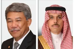 الأمير فيصل بن فرحان والوزير محمد حسن (الخارجية السعودية)