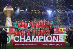 Morocco's players celebrate with the winner trophy after defeating Jordan in the FIFA Arab Cup final soccer match in Lusail, Qatar, Thursday, Dec. 18, 2025. (AP Photo/Hussein Sayed)