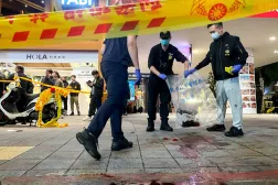 Police collect evidence from a crime scene outside Eslite Spectrum Nanxi store near Zhongshan station as the entrance of the building is cordoned off with yellow crime scene tape, in Taipei, Taiwan, December 19, 2025. REUTERS/Ann Wang