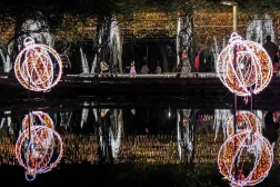  People visit a street decorated with lights ahead of the Christmas festival in Pingtung, southern Taiwan, on December 22, 2025. (AFP) 
