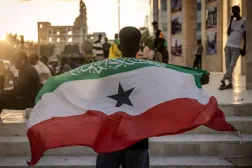 A man holds a flag of Somaliland in front of the Hargeisa War Memorial monument in Hargeisa on November 7, 2024. (AFP)