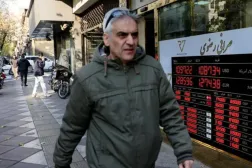 A man walks past a sign at a currency exchange bureau as the value of the Iranian rial drops, in Tehran, Iran, December 20, 2025. (Via Reuters)
