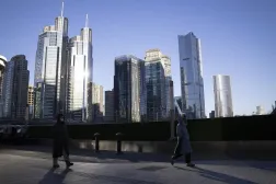 Pedestrians walk along a street in the Central Business District of Beijing, China, 31 December, 2025. (EPA)