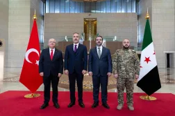 This handout photograph released by the Turkish Foreign Ministry press service shows Turkish Foreign Minister Hakan Fidan (2nd-L) and Turkish Minister of National Defense Yasar Guler (L) meeting with Syria's Foreign Minister Asaad al-Shaibani (2nd-R) and Syria's Defense Minister Murhaf Abu Qasra (R) in Damascus on December 22, 2025. (Turkish Foreign Ministry Press Service / AFP) 