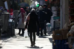 An Iranian woman walks with her shopping bag in a street in Tehran, Iran, 31 December 2025. EPA/ABEDIN TAHERKENAREH
