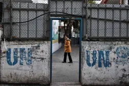 A girl stands in the courtyard of a building of the United Nations Relief and Works Agency for Palestine Refugees (UNRWA) in the Askar camp for Palestinian refugees, east of Nablus in the Israeli-occupied West Bank, on December 31, 2025. (AFP)