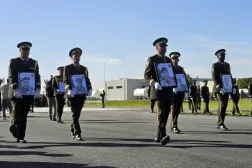 Military personnel carry portraits of the Libyan chief of staff, General Mohamed al-Haddad (2-R), and his four advisers, who were killed in a plane crash in Türkiye, during an official repatriation ceremony at the Ministry of Defense headquarters in Tripoli, Libya, 27 December 2025. (EPA) 
