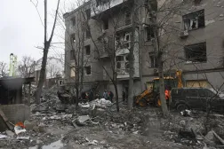 Ukrainian rescuers work at the site of a Russian strike on a residential area a day before, in Kharkiv, northeastern Ukraine, 03 January 2026. (EPA)