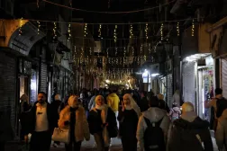 Crowds gather in a street decorated with lights during New Year celebrations in Damascus, Syria, 31 December 2025. (EPA) 
