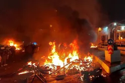 10 January 2026, Iran, Tehran: A police station is set on fire during protests in Tehran in response to worsening economic conditions. ZUMA Press Wire/dpa 