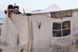  Displaced Palestinians shelter in a tent camp in Deir al-Balah, central Gaza Strip, January 19, 2026. (Reuters)