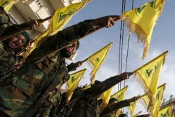 Lebanon’s Hezbollah members carry Hezbollah flags during the funeral of a fellow fighter, in al-Ghaziyeh village, southern Lebanon May 26, 2015. REUTERS/Ali Hashisho