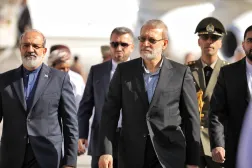 A handout photo made available by Iran's Supreme National Security Council office shows Secretary of the Supreme National Security Council Ali Larijani (C) arriving in Muscat, Oman, 10 February 2026. (EPA/ Iran's Supreme National Security Council office / Handout) 