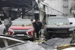 Ukrainian people survey the site of the overnight Russian attack on the residential area in Odesa, Ukraine, 13 February 2026. EPA/IGOR MASLOV