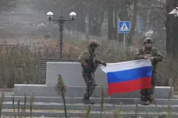 FILE PHOTO: Soldiers hold a Russian flag in Pokrovsk, Donetsk Region, Ukraine, in this screengrab from video released December 1, 2025. Russian Defense Ministry/Handout via REUTERS   