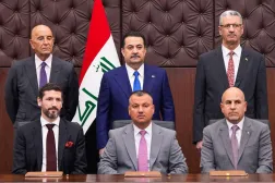 This handout picture made available by the Iraqi prime minister's office shows Iraq's Prime Minister Mohammed Shia al-Sudani (top C), Oil Minister Hayan Abdel-Ghani (top R), US Special Envoy to Iraq Tom Barrack (top L), Chevron's Director of Business Development Joe Koch (bottom L), Iraq's North Oil Company Director Amer Khalil (bottom C), and the Director of the Dhi Qar Oil Company Said Zghair Shallagha (bottom R) attending the signing of agreements between Chevron Corporation and the Dhi Qar and North Oil Companies at the government palace in Baghdad on February 23, 2026. (Handout / Iraqi Prime Minister’s Press Office / AFP)  