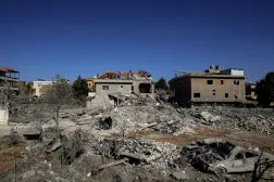 21 February 2026, Lebanon, Bednayel: Pro-Iranian Hezbollah supporters inspect damage of house that was hit by an Israeli air strike in the village of Bendayel in Lebanon's Bekaa valley. (dpa) 