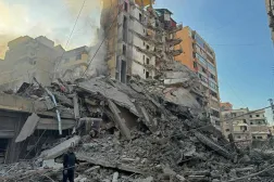 A man inspects the debris of destroyed buildings at the site of an Israeli airstrike that targeted Haret Hreik neighborhood in Beirut's southern suburbs, on March 7, 2026. (AFP)