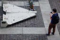 A visitor of an exhibition takes a photo of parts of an Iranian made unmanned aerial vehicle (UAV) Shahed-131/136, which was launched on Ukrainian territories, amid Russia's attack on Ukraine, in Kyiv, Ukraine June 27, 2025. (Reuters)