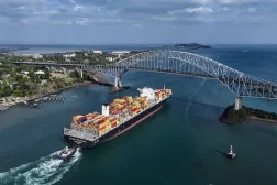 A cargo ship sails under Las Americas bridge through the Panama Canal, in Panama City, Thursday, March 12, 2026. (AP)