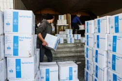 Volunteers carry World Food Program (WFP) boxes of aid supplies in a school-turned-shelter in Beirut, following an escalation between Hezbollah and Israel amid the US-Israeli conflict with Iran, Lebanon, March 12, 2026. REUTERS/Mohamed Azakir
