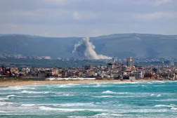 This photograph taken from the southern Lebanese area of Tyre shows smoke rising from the site of an Israeli strike that targeted the southern village of Qlaileh on April 11, 2026. (AFP)