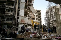  12 April 2026, Lebanon, Beirut: People and civil defense workers search for human remains amid the debris of a collapsed building following an Israeli air strike at the Beirut seafront. (dpa)