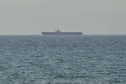 A ship is seen off the coast of Ras al-Khaimah, the day after the failure of US-Iran peace talks on April 13, 2026. (AFP)