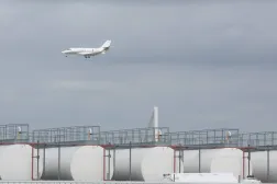  Aircraft pass behind kerosene storage facilities at Liege Airport in Liege, Belgium, 16 April 2026.  EPA/Olivier Hoslet