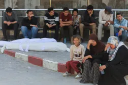 People mourn next to the bodies of Palestinian brothers Abdel Malek and Abdel Sattar Al-Attar, who were killed in an Israeli strike, according to medics, during their funeral, at Al-Shifa Hospital in Gaza City, April 16, 2026. REUTERS/Dawoud Abu Alkas