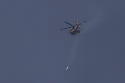  An Israeli helicopter fires a projectile, as it flies over Lebanon, after a 10-day ceasefire between Lebanon and Israel went into effect, as seen from Israel, April 17, 2026. (Reuters)