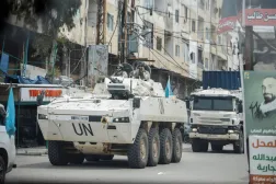 A UNIFIL convoy rides through the town, as seen through the window of a vehicle, in Tyre, south Lebanon, April 15, 2026. REUTERS/Louisa Gouliamaki