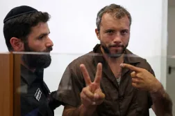 Brazilian activist Thiago Avila gestures upon his arrival at a court in Ashkelon on May 3, 2026. Photo by Ilia YEFIMOVICH / AFP)