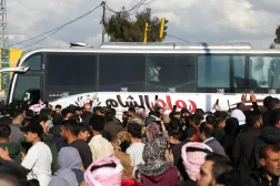 People gather as prisoners from the Syrian Democratic Forces (SDF) arrive after being released under an agreement between the SDF and the Syrian government, in Hasakah, Syria, April 11, 2026. REUTERS/Orhan Qereman