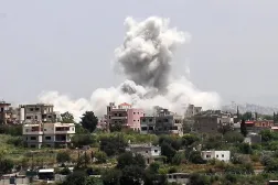 Smoke rises from the site of an Israeli airstrike that targeted the southern village of Al-Halloussiyah on May 13, 2026. (AFP)