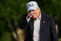  President Donald Trump gestures to reporters as he walks across the South Lawn of the White House, Friday, May 15, 2026, in Washington, on return from Beijing where he met with China's President Xi Jinping. (AP) 