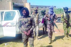 This handout picture released by the Sudanese Rapid Support Forces (RSF) on October 30, 2025, shows RSF members reportedly detaining a fighter known as Abu Lulu (L) in al-Fashir in war-torn Sudan's western Darfur region. (RSF / AFP)