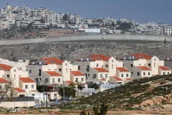 The Neve Yaakov settlement north of East Jerusalem, with the Israeli wall visible separating the Palestinian neighborhood of al-Ram in the West Bank (AFP). 