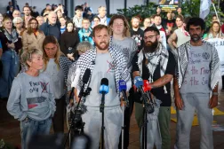Members of a Gaza-bound flotilla, that were detained by Israeli security forces last week, speak during a press conference after arriving at Sydney International Airport on May 25, 2026. (AFP)