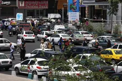 Commuters make their way along the busy Sadeghiyeh Square in Tehran on May 31, 2026. (AFP)