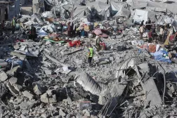 Palestinians assess damage at the site of an Israeli airstrike in Khan Younis, southern Gaza Strip, on June 7, 2026. (AFP)