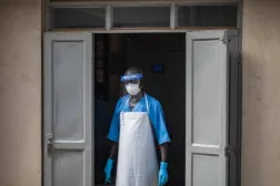 A health worker wearing a face mask as part of his personal protection equipment (PPE) looks on at the Mulago National Referral Hospital isolation unit in Kampala, Uganda, on July 8, 2026. (AFP)