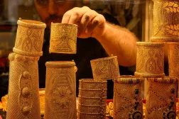 A vendor displays gold bracelets for sale at a gold shop in Istanbul's Grand Bazaar (AFP)