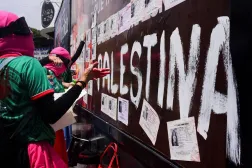  Demonstrators place missing person flyers on the trailer of a mounted police truck during a protest outside Azteca Stadium ahead of the opening match of the 2026 FIFA World Cup in Mexico City, Mexico, June 11, 2026. (Reuters)