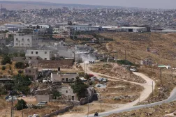 Israeli bulldozers guarded by Israeli soldiers demolish the home belonging to the Palestinian al-Atrash family, citing the lack of a building permit, in the village of Qilqes, a few kilometers from the Israeli settlement of Beit Hagai, just south of the Israeli-occupied West Bank city of Hebron on June 23, 2026. (AFP)