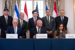Secretary of State Marco Rubio and others watch, as seated from left, Israel's Ambassador to the US Yechiel Leiter, counselor Dan Holler, and Lebanon's Ambassador to the US Nada Hamadeh, sign a framework agreement, described as a first step toward peace following months of conflict between Israel and the Lebanese militant group Hezbollah, at the State Department, Friday, June 26, 2026, in Washington. (AP Photo/Kevin Wolf)

