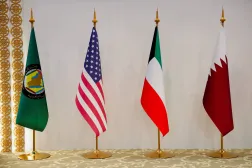 أعلام قطر وإيران والولايات المتحدة والكويت (أرشيفية - رويترز)