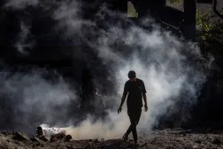 A Palestinian inspects a destroyed area following an Israeli airstrike in southern Gaza City, 12 July 2026. (EPA)
