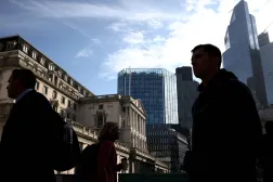 FILE PHOTO: People walk outside the Bank of England in the City of London financial district in London, Britain May 11, 2023. REUTERS/Henry Nicholls/File Photo